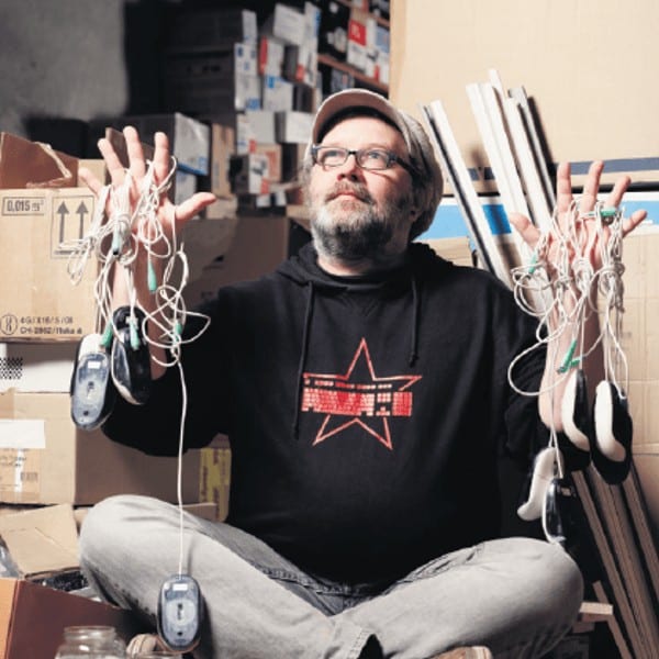 Man Black Sweater Holding Cords